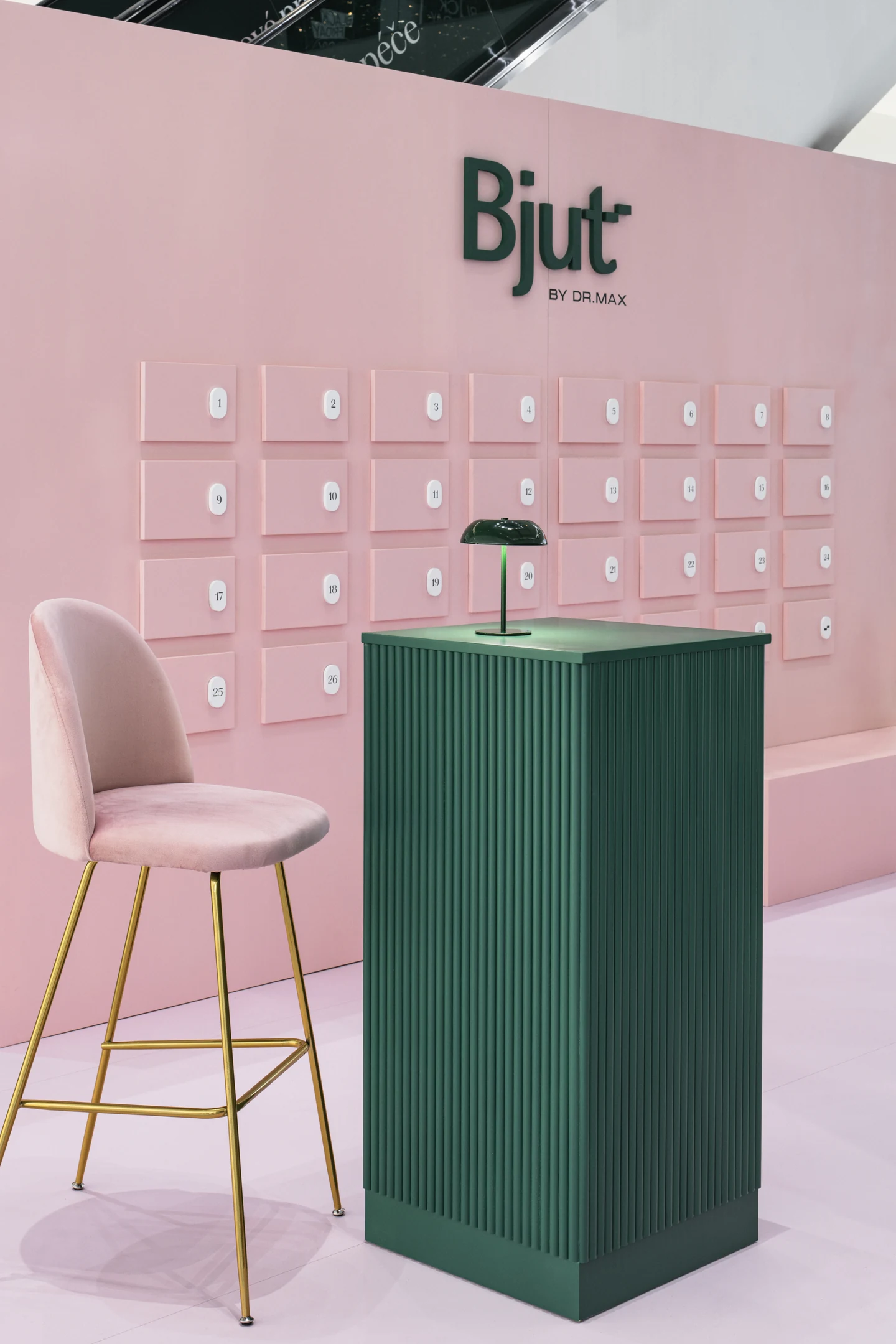 Detail of the green counter and pink Bjut chair